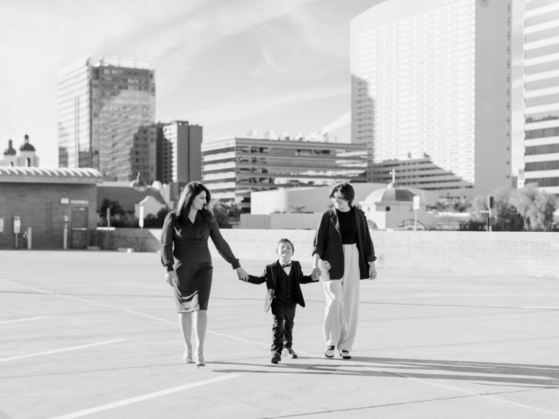 family of three walking towards the camera