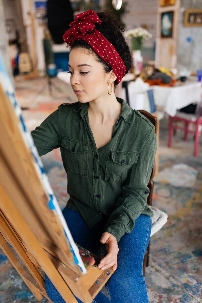 Close up photo of a woman doing art