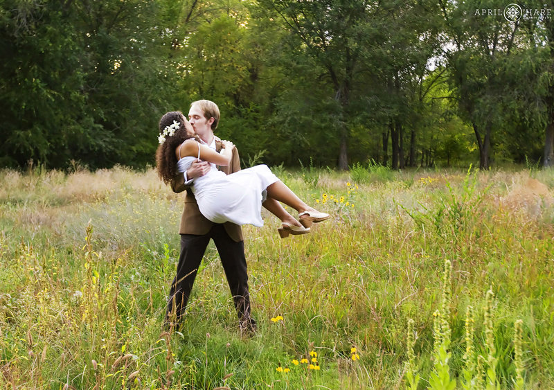 Sweet wedding photo in the fields at Rancho Manzana in Chimayo New Mexico