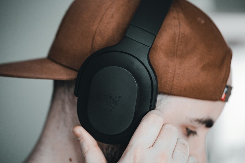 Male listening to Safe and Sound Protocol on headphones at home