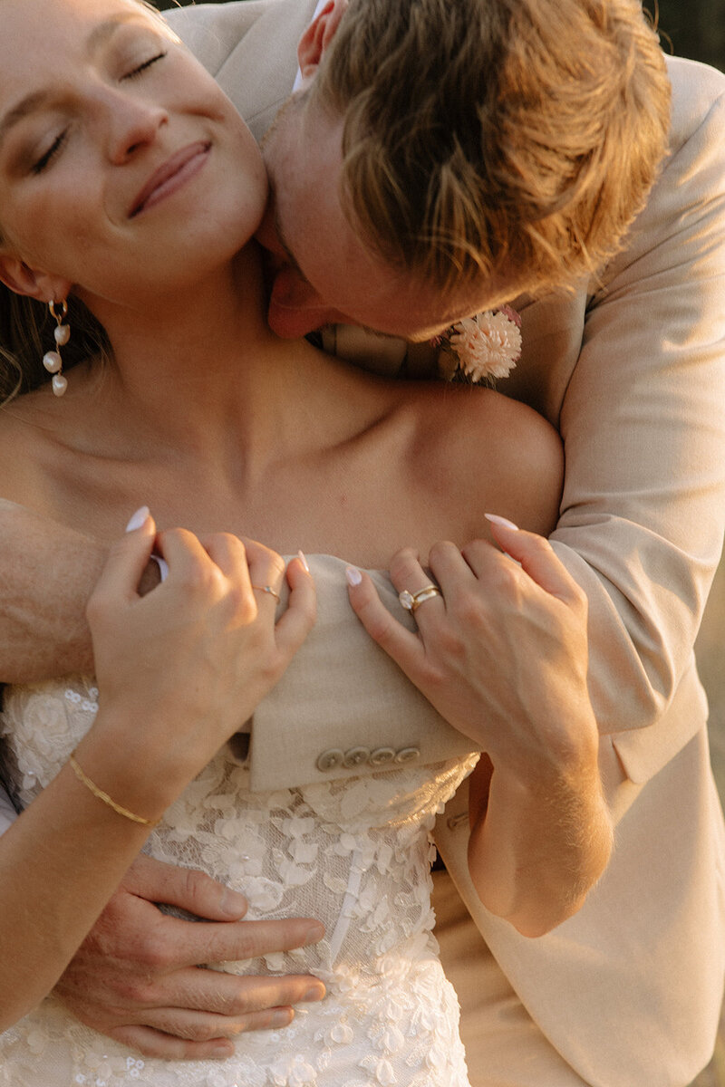 couple embracing with orange sunset