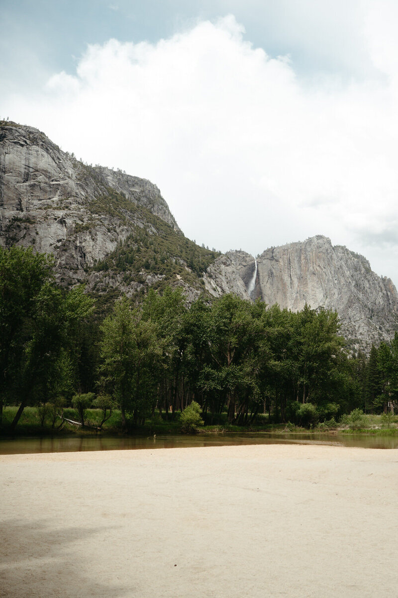 A small river beach with a view of Yosemite Falls, it's a great spot for a Yosemite elopement 
