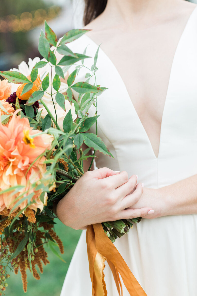 bride with orange bouquet