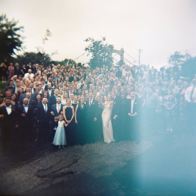 film photo by tom thornton photography of wedding party guests in minnesota with light leak