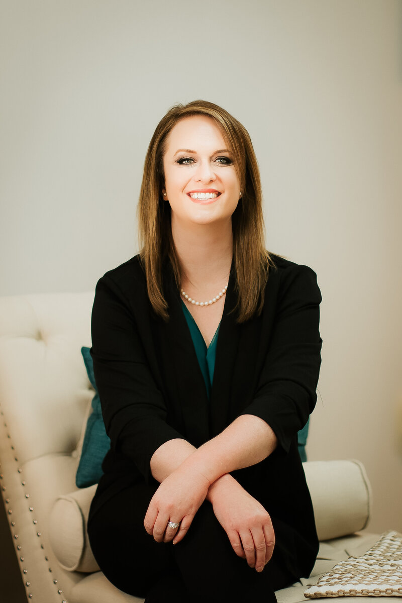 Susan Prather smiling confidently in a modern office — Integrative NP business mentor