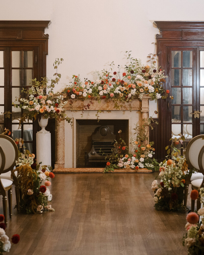 A lush meadow of flower arrangements at a Theatre St James wedding. 