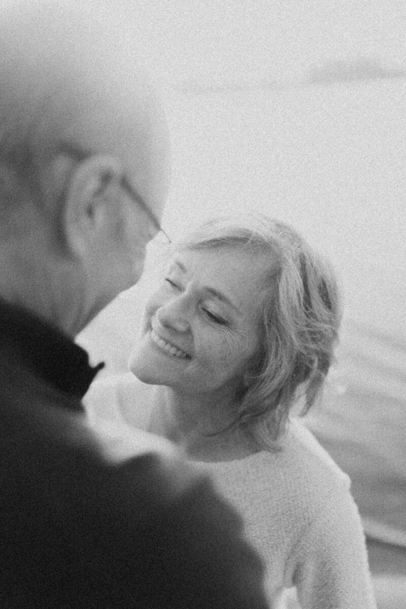 couple hugging and smiling, black and white