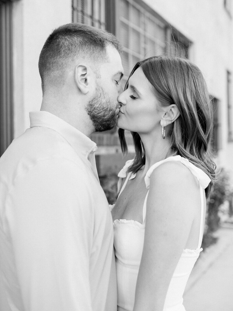 Couple embrace during their chic engagement session in West Village in NYC