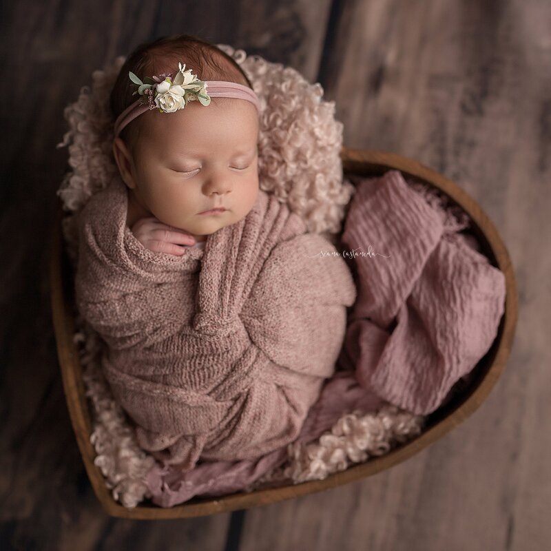 newborn baby girl in heart shaped basket  los angeles