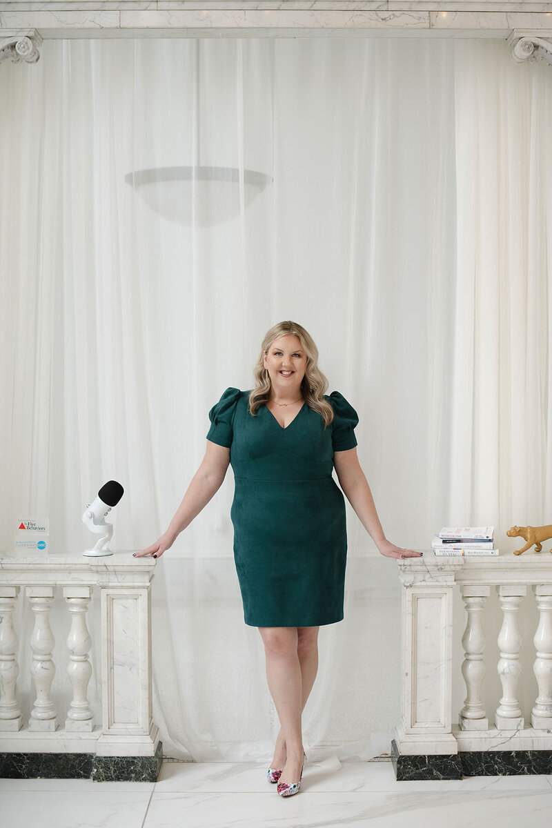 Your Worthy Career podcast host, Melissa Lawrence, smiles in green dress