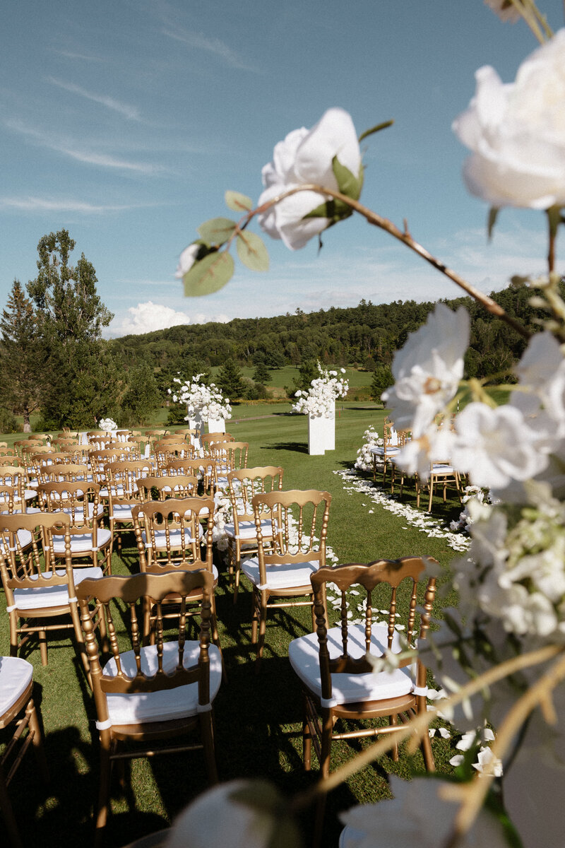 stunning high end wedding details of ceremony site at private golf course in toronto, ontario
