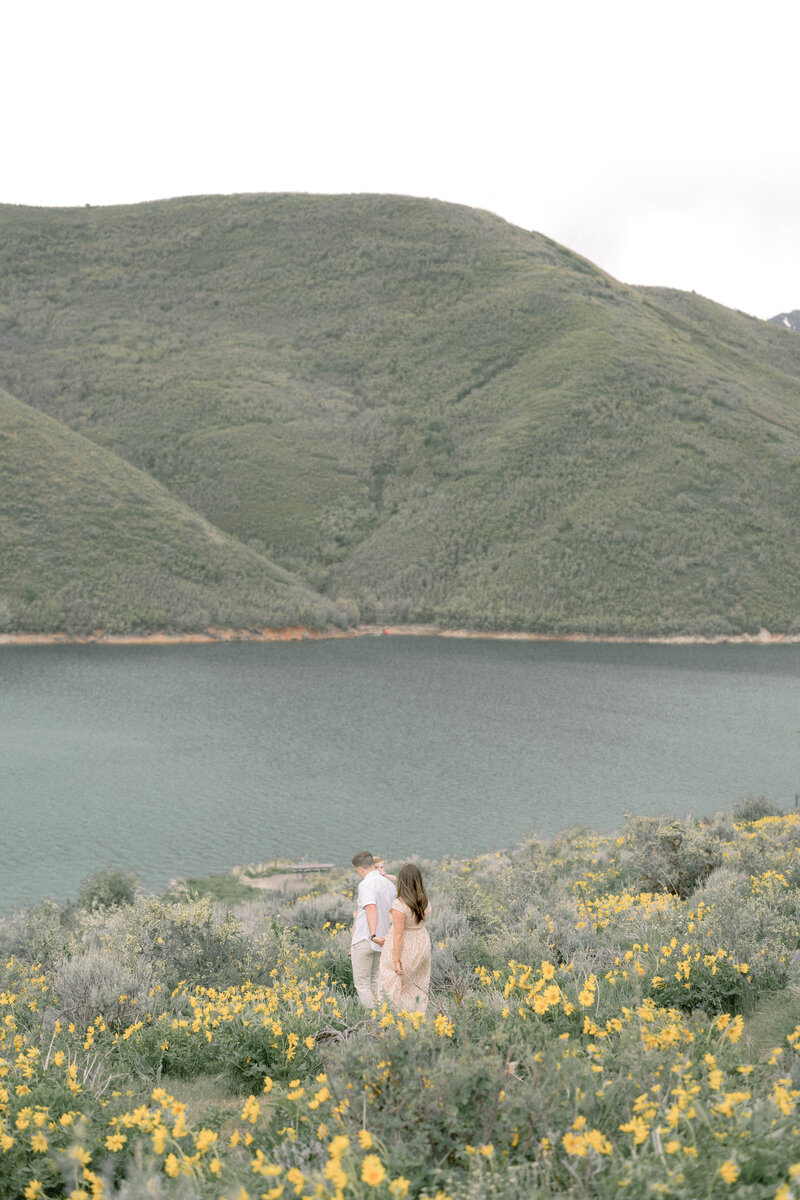 family session walking through the flowers holding hands with Sandra Vallejo Photography in Miami