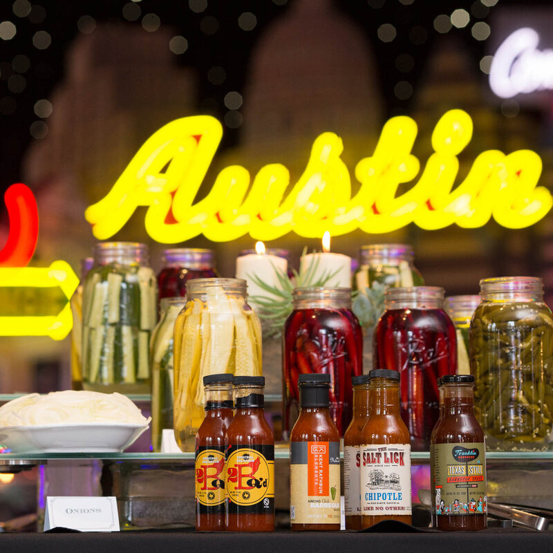 pickle bar and bbq sauce with austin neon lights at bob bullock museum