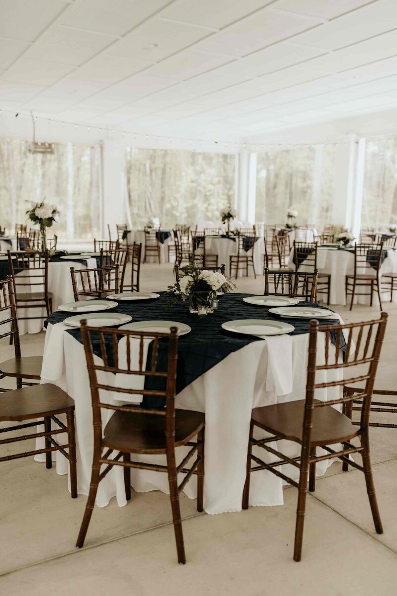 Classic white and dark blue reception tables