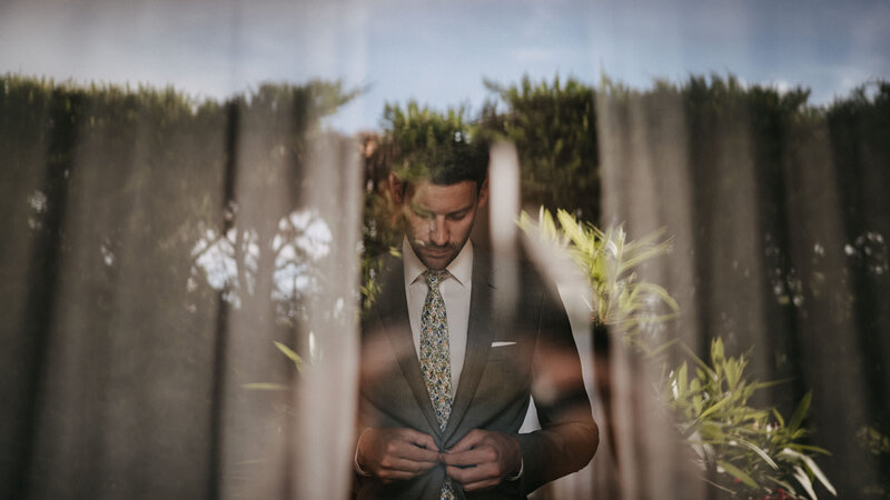 groom getting ready exclusive wedding in tuscany borgo santo pietro