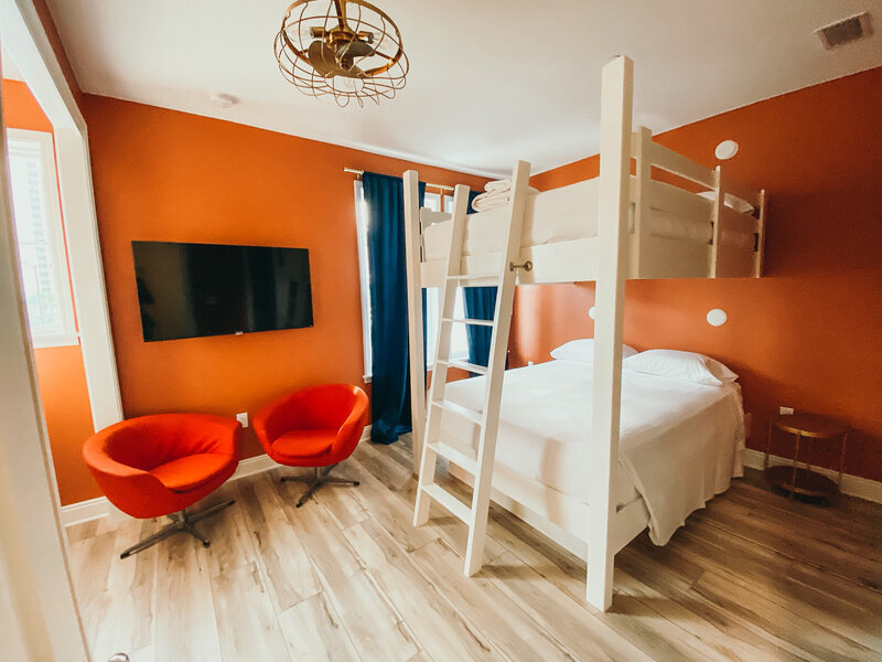 orange bedroom with white bunkbeds