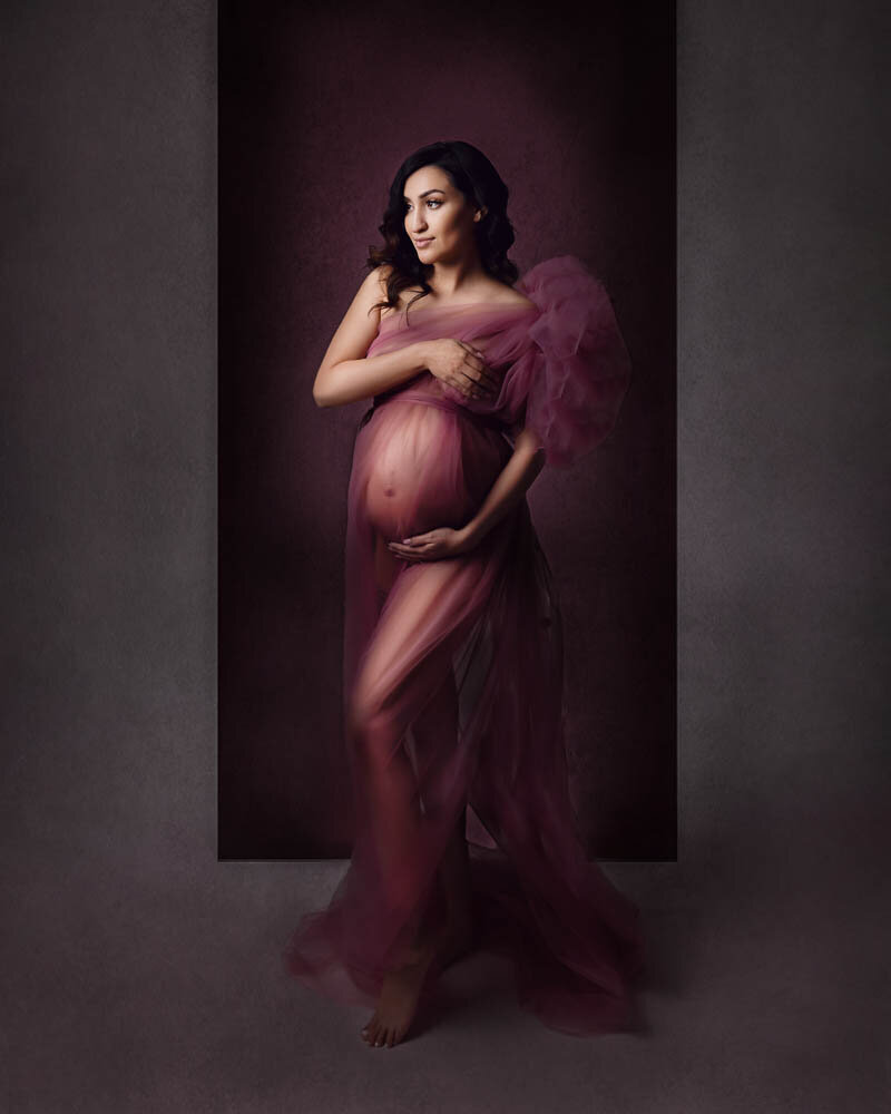 maternity session, mom wearing sheer darker vintage pink dress, semi see through. 