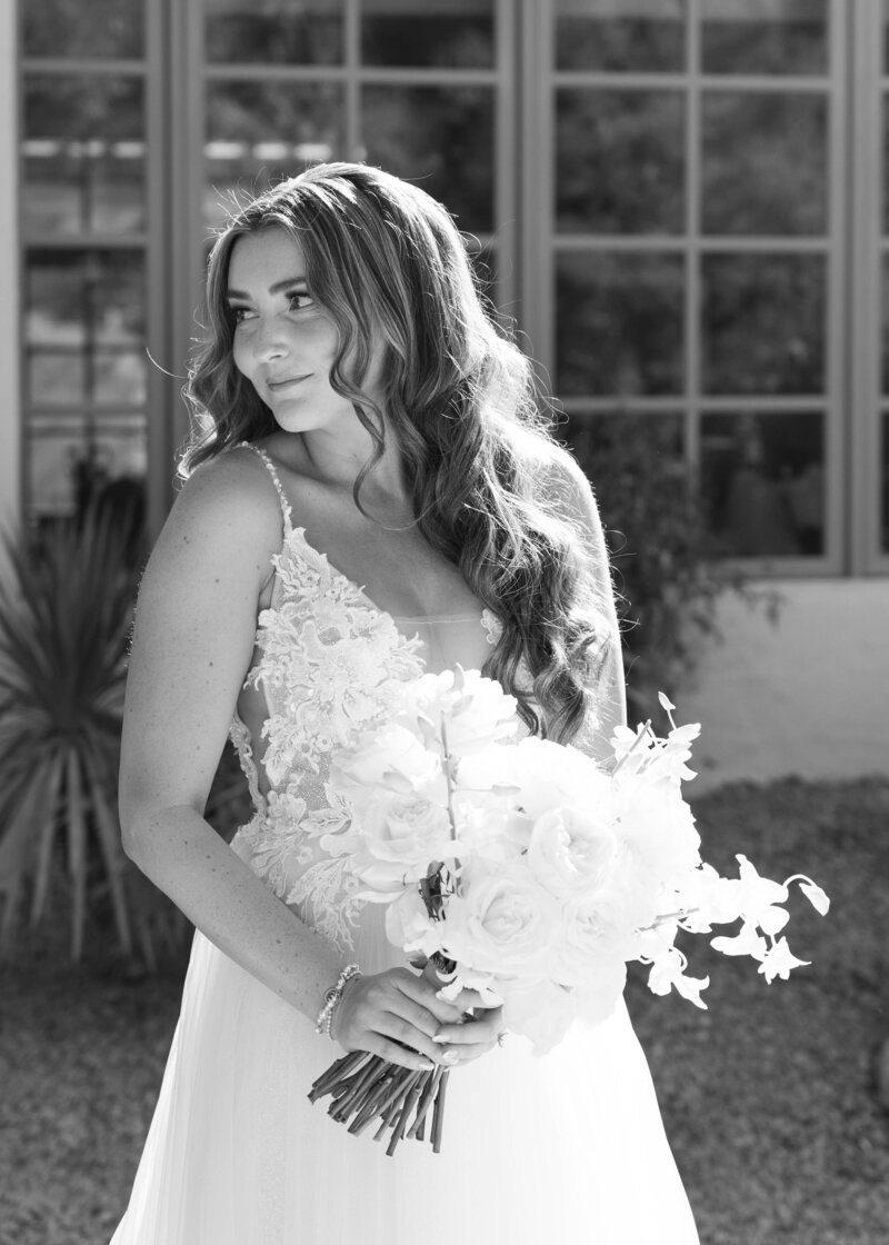 Bride in an elegant moment at a luxurious Arizona wedding venue.
