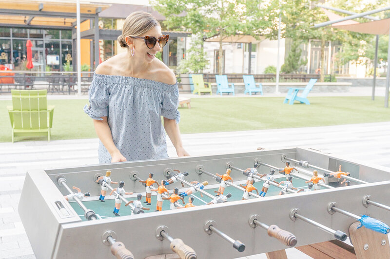 woman playing foosball during Arlington,Virginia branding picture