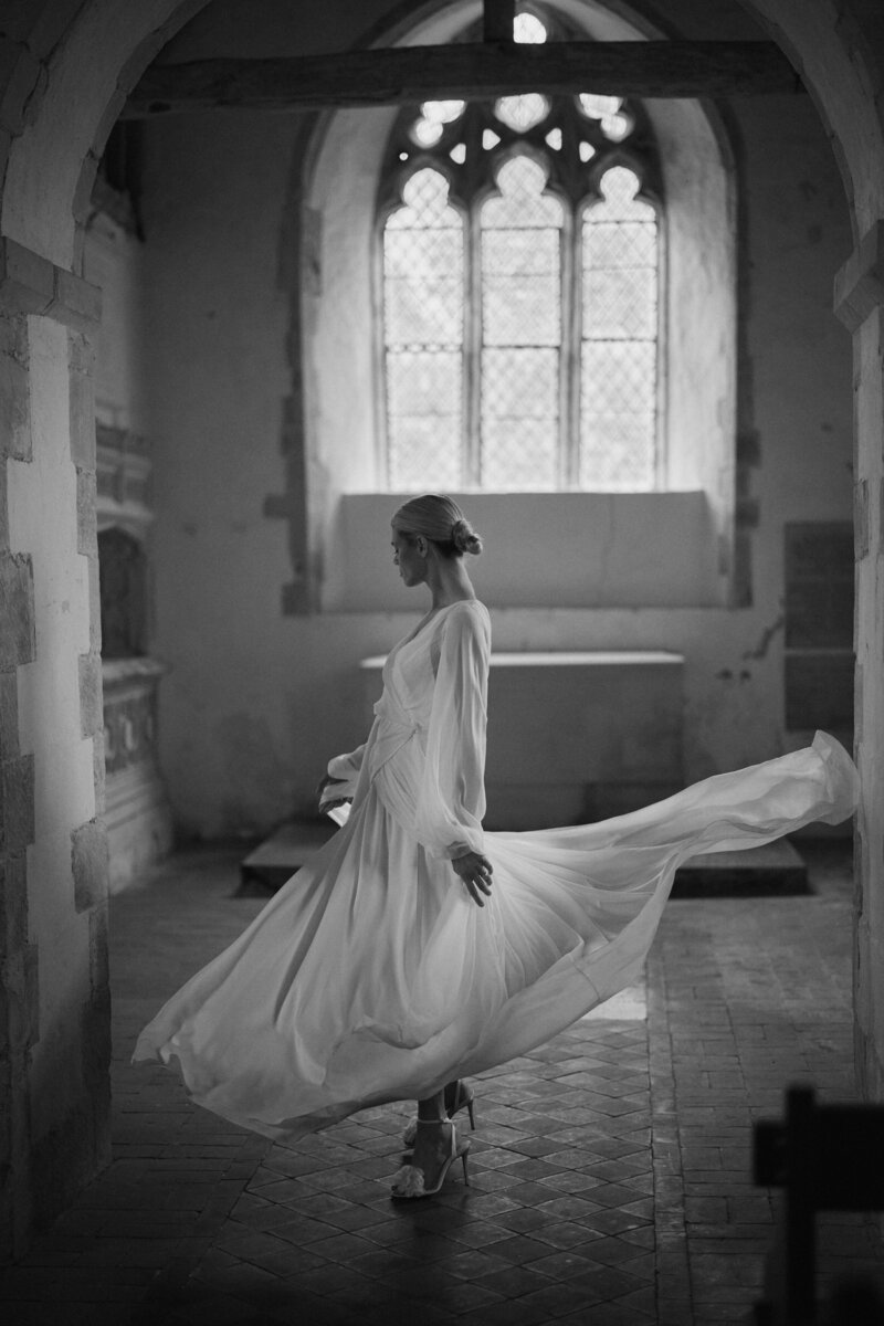 Georgette silk wedding dress by british bridal designer worn by bride in chapel
