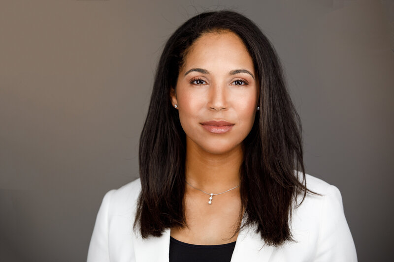 Headshot of woman with dark hair.