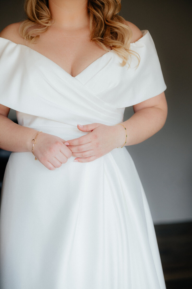 Close up of the bride's wedding dress.