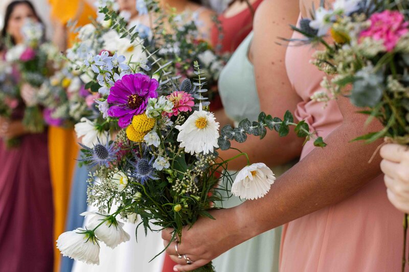 bridesmaids holding bouquets