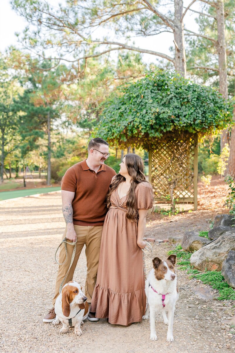 Married couple posing with their dogs at anniversary session