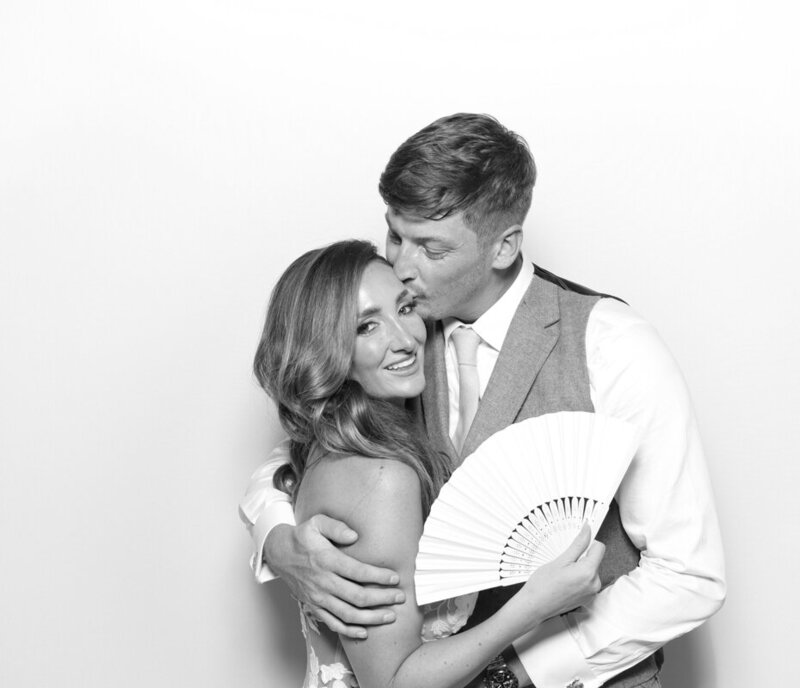 B&W image of bride and groom during a wedding party entertainment for Mad Hat Photo Booth Hire in the Cotswolds, for weddings and parties, at Ivy Lodge wedding venue