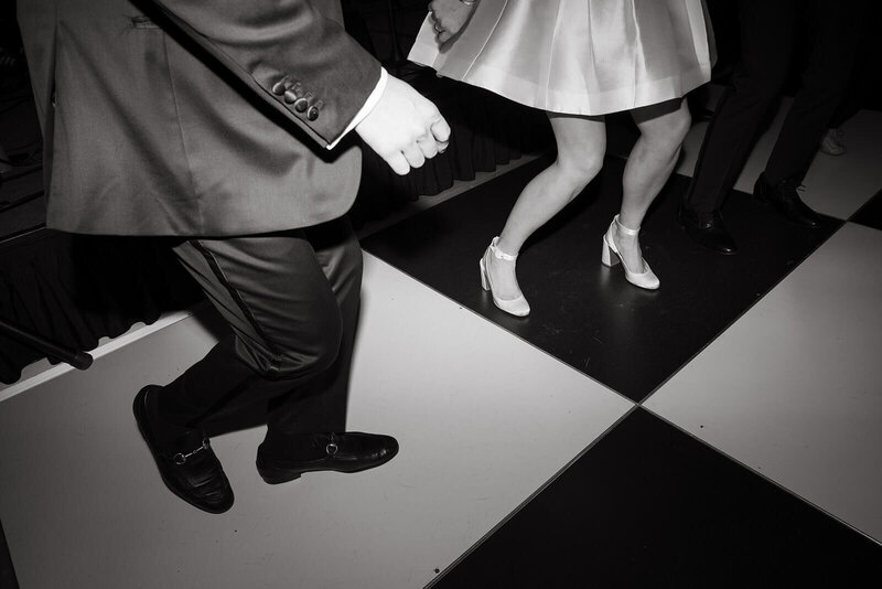 Image shows bride smiling with her bridesmaids.