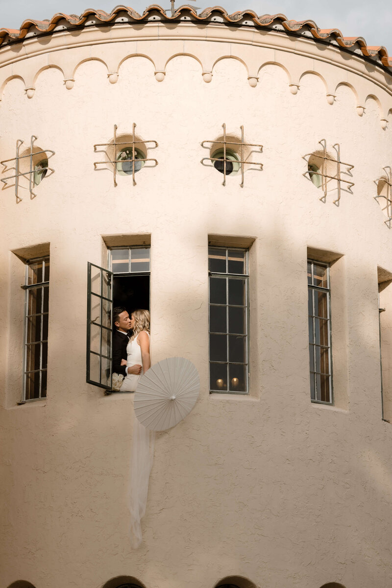 beautiful bride in front of the Howey mansion wedding venue