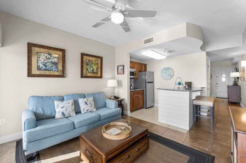 blue sofa and brown coffee table chest