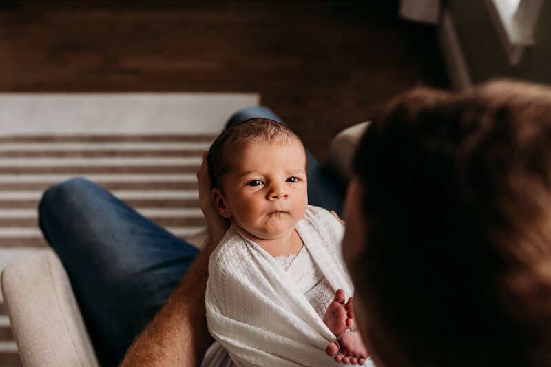 Mother with her newborn baby during photography in Charlotte