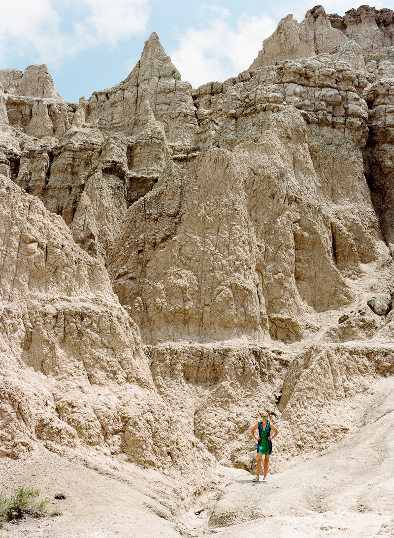 Wedding photographer Susannah wearing a sparkly dress at Badlands National Park