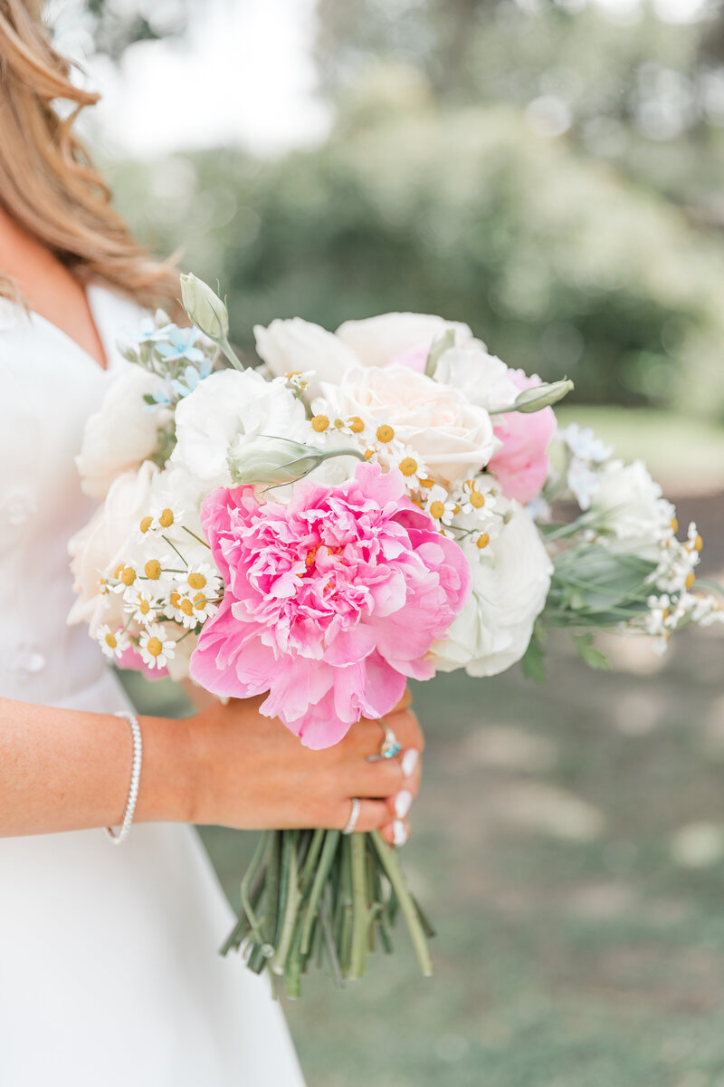 Bride holding beautiful Spring bouquet at Boone Hall