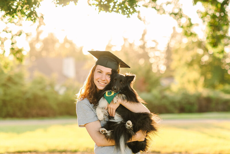 Granada High School graduate taking cap and gown photos with her dog