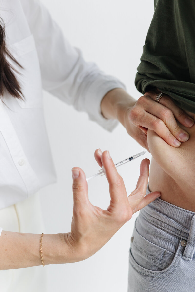 Liv Med Spa specialist in Sioux Falls administering a safe GLP-1 injection for weight management.