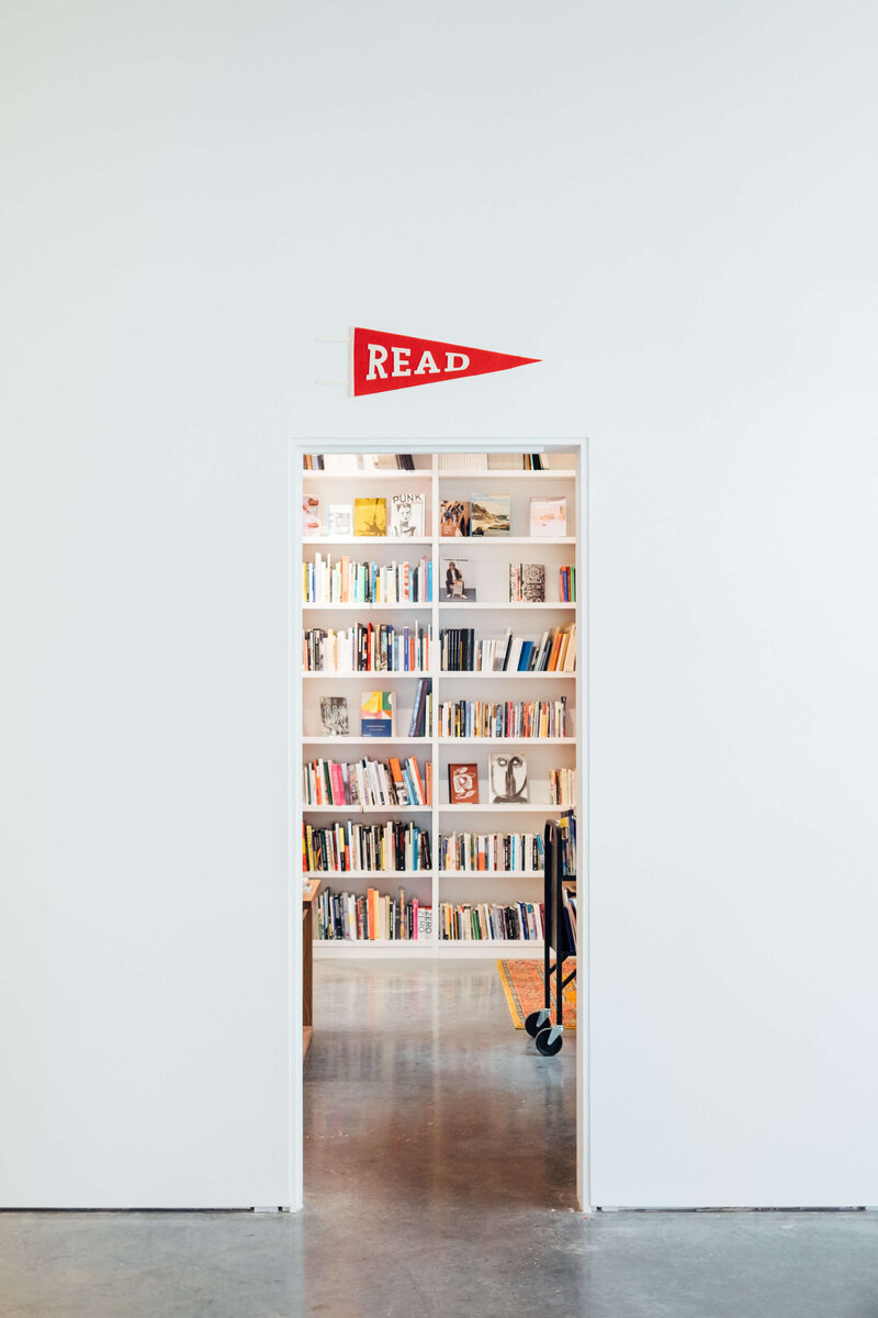 bright modern library with books on shelves