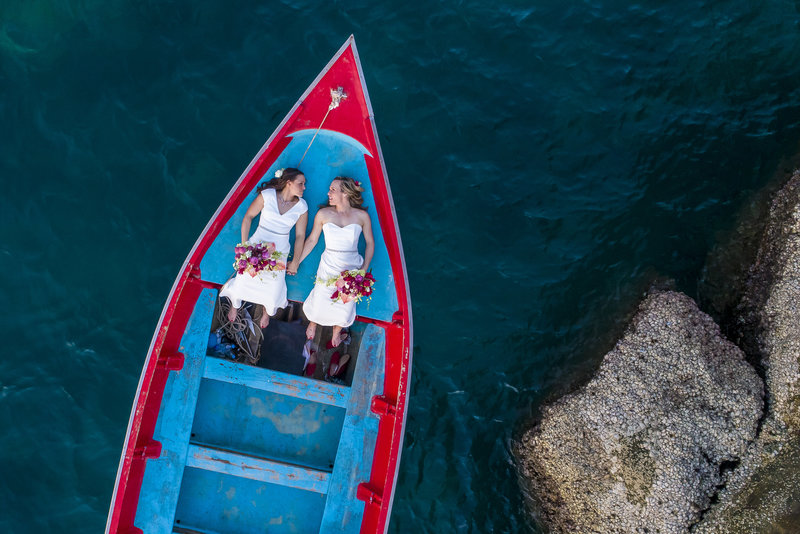 Two brides on longtail boat, Thailand