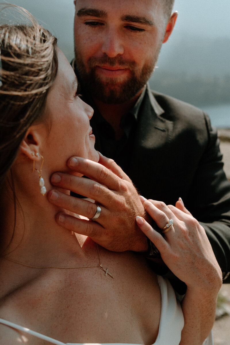 a couples saying their vows in colorado next to a river