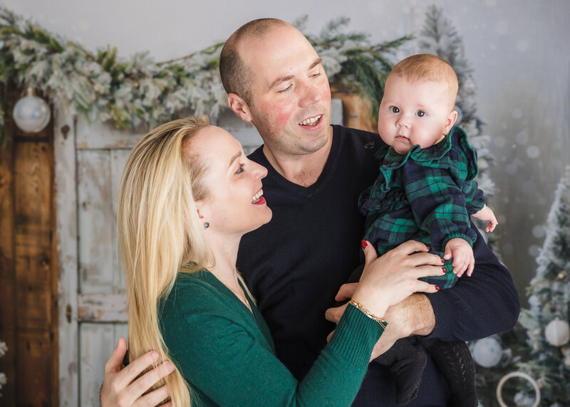 Holiday portrait of hugging family at Allison Reilly's Union County, NJ photo studio.