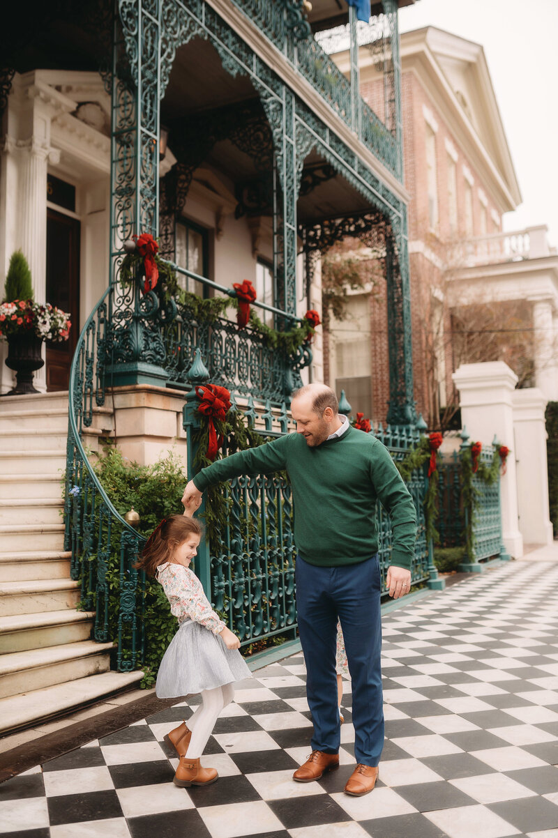 Little girls laughs into the camera during Family Photoshoot in Charleston, South Carolina.