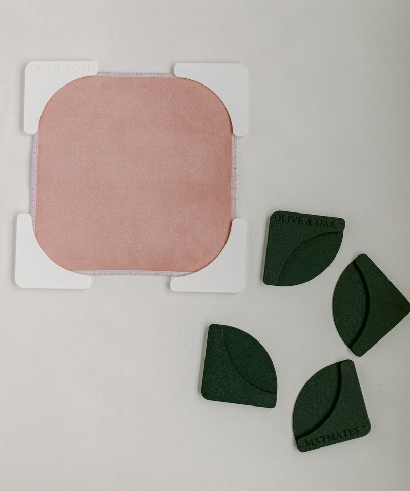 Mat Mates used to hold down styling mat corners for stable flat lay photography