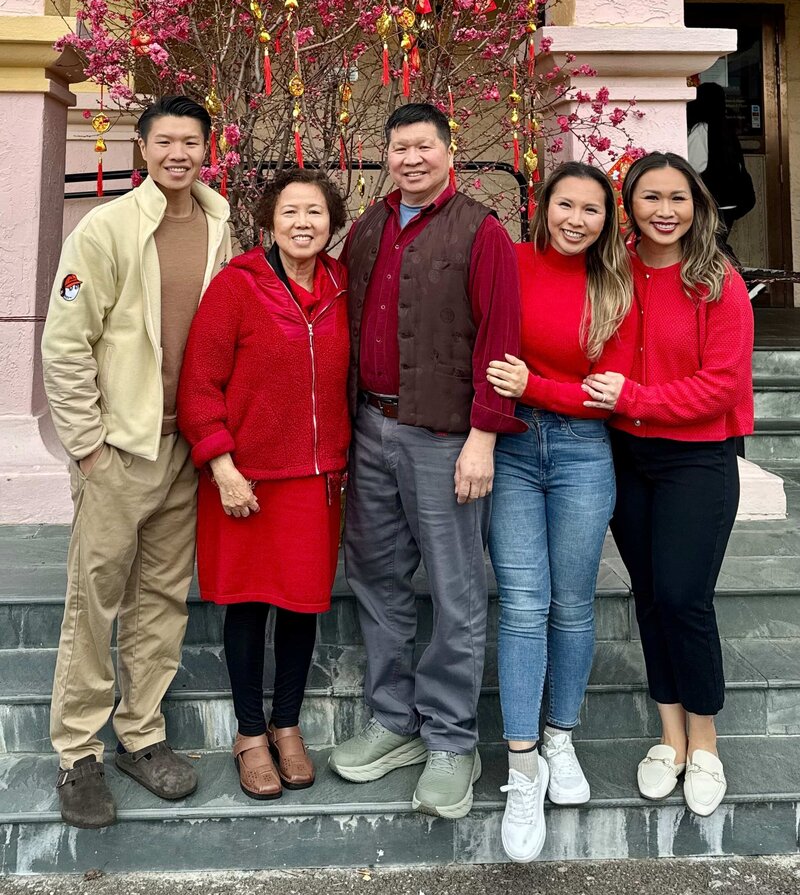 Bay Area Lifestyle Photographer - Ellobelle Photography Family Photographer standing with family in red attire for Lunar New Year