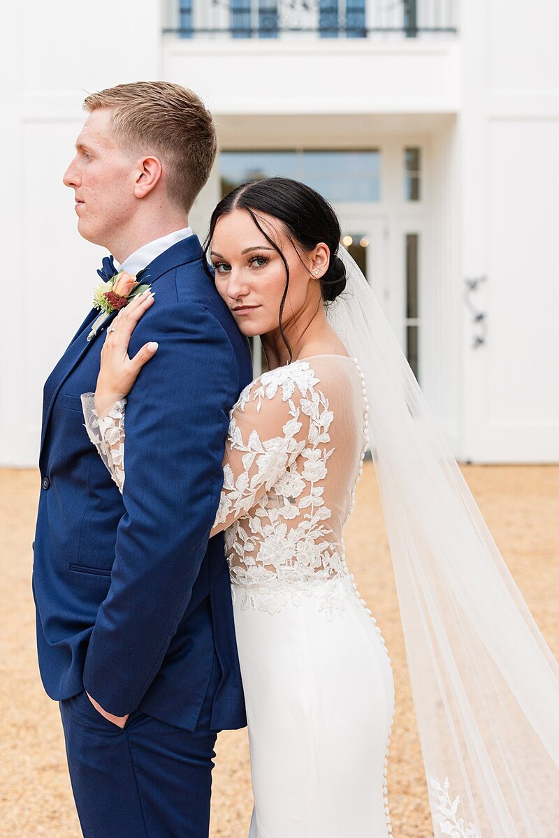 A more serious and editorial bride and groom portrait in front of the beautiful Ivy Rose Barn in Rocky Mount, Virginia.