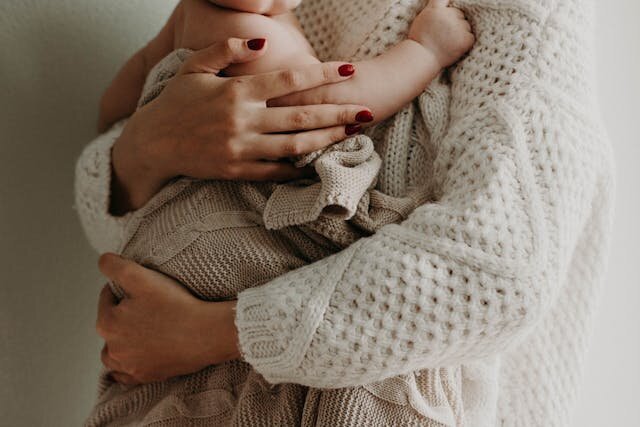 mom holding a baby