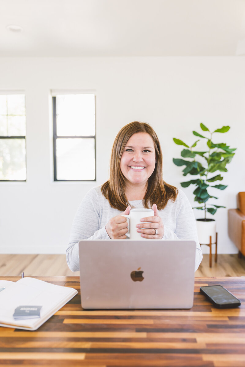The media relations and social media management workspace, equipped with a laptop and agenda for efficient communication and strategy planning.