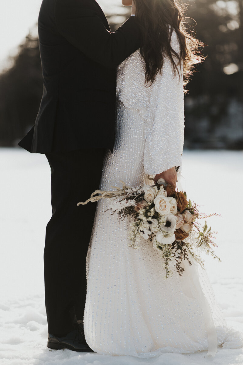 Winter wedding photography in Hayward, Wisconsin with a bride wearing a sparkly wedding gown.