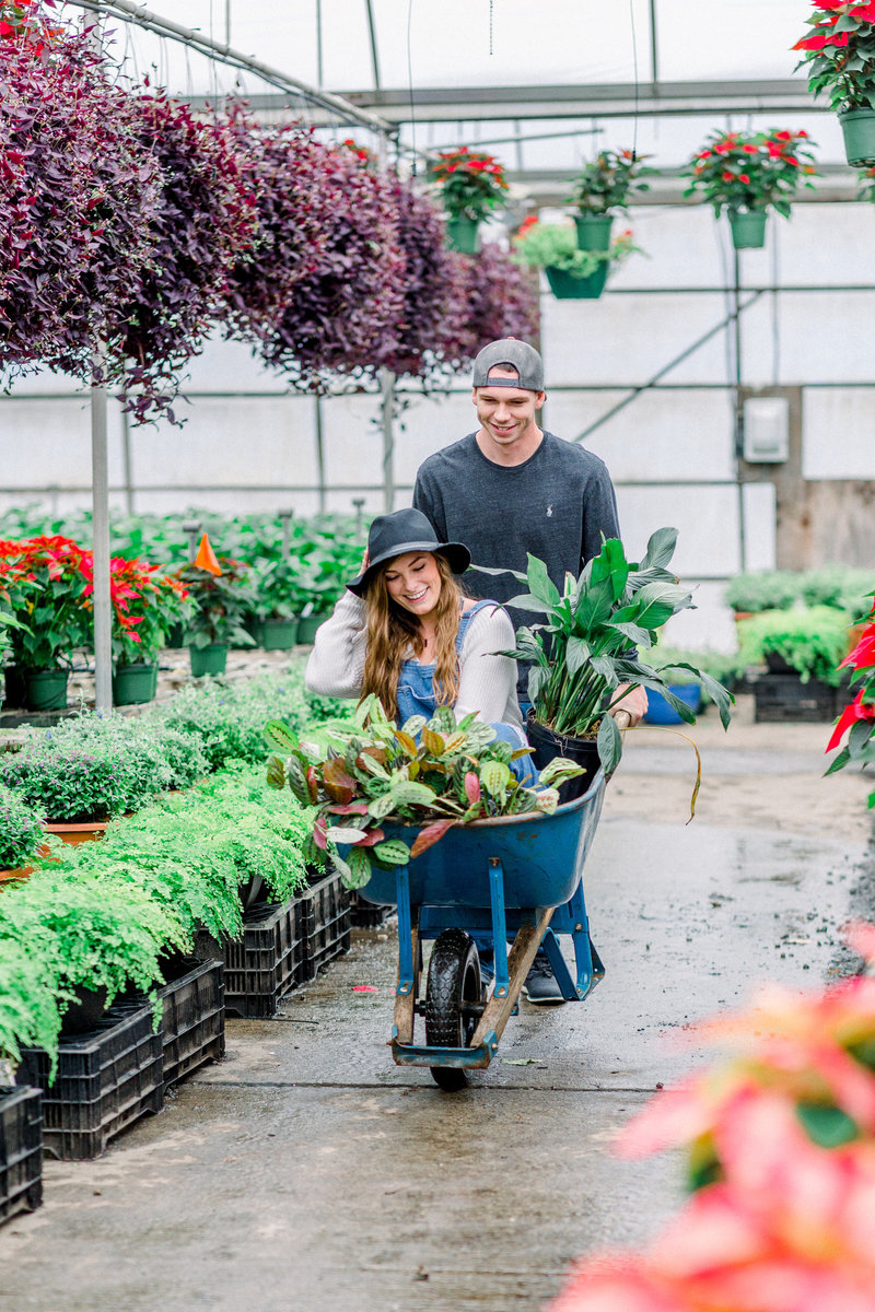 Plant  loving couple photo at a greenhouse by Staci Addison Photography