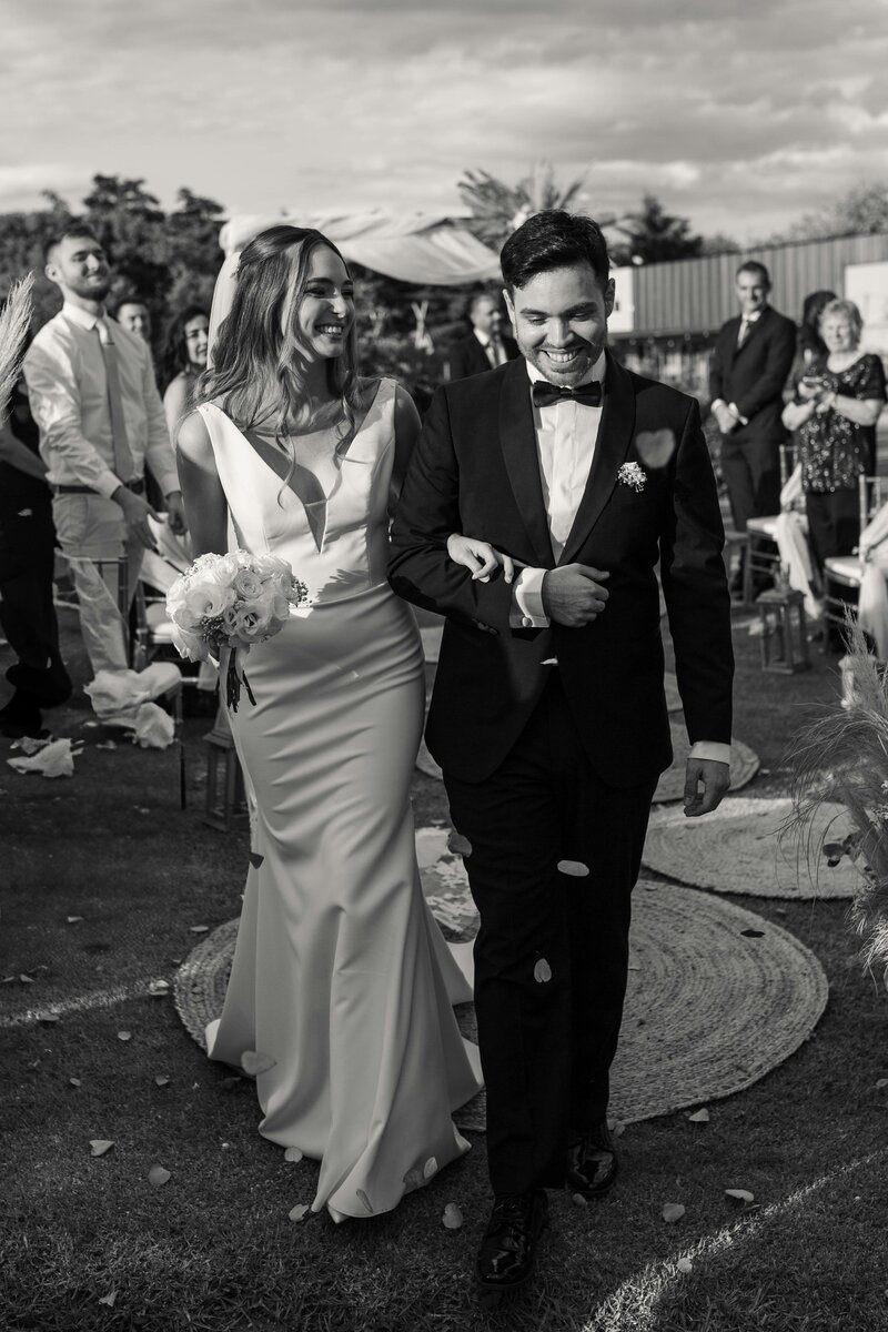 A joyful couple walks down the aisle as confetti fills the air, celebrating their perfectly planned wedding day. Girasole & Co. Weddings—Columbus, Ohio’s premier wedding planner—helps engaged couples create seamless, stress-free, and beautifully designed weddings. Let us bring your dream day to life!